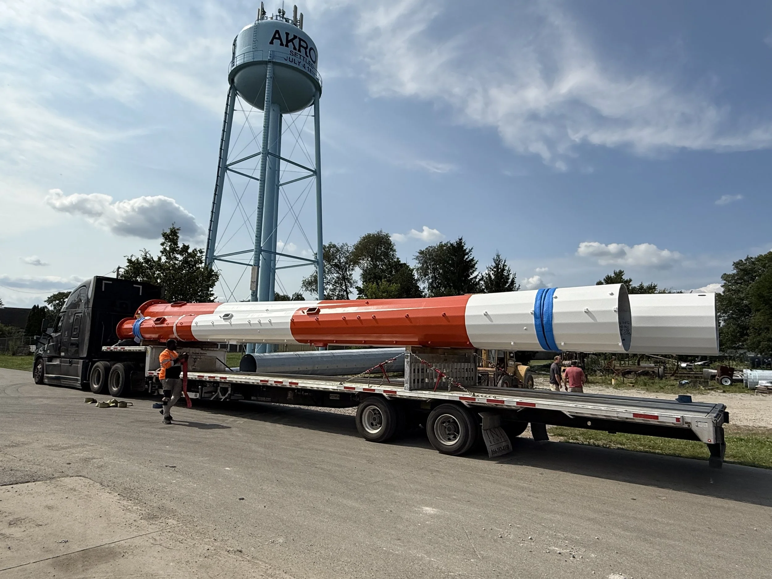 Telecommunications tower expertly coated with high-performance industrial paint for corrosion resistance and lasting structural protection.