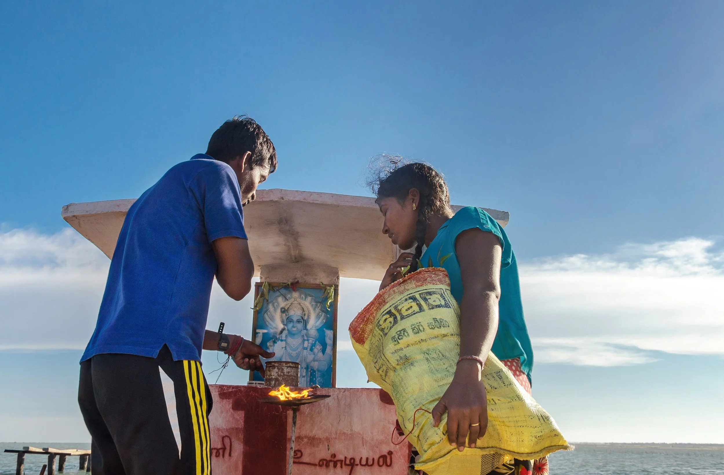 The young couple prayed to God before embarking on a sea journey in Jaffna