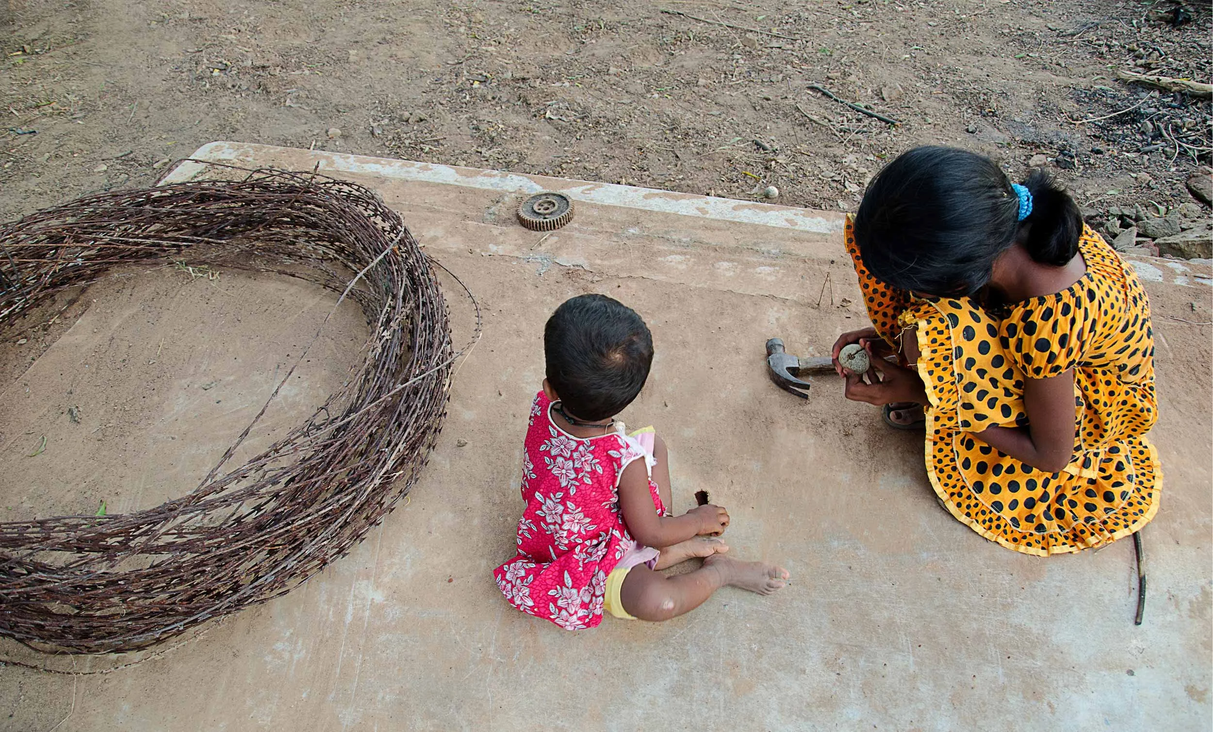 During the thirty years of war, people had to abandon their homes and flee. After the war, upon their return, they found only the foundations remaining. In a family with no adults, Akka (elder sister) broke a diwul (wood apple) fruit to feed her youn