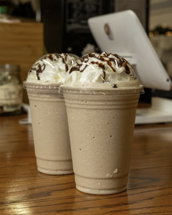 Handcrafted iced coffee prepared with flavored syrups at Kaffee Klatsch inside Dayton Market.