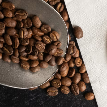 Close-up of premium roasted coffee beans available at Kaffee Klatsch.