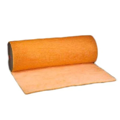 A roll of pink insulation material unrolled on a flat surface.