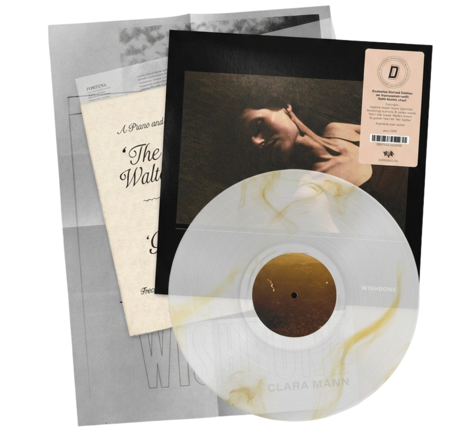 The collected elements of the Dinked Edition of Clara Mann's album Wishbone including a gold and transparent marbled LP, sheet music and a poster.