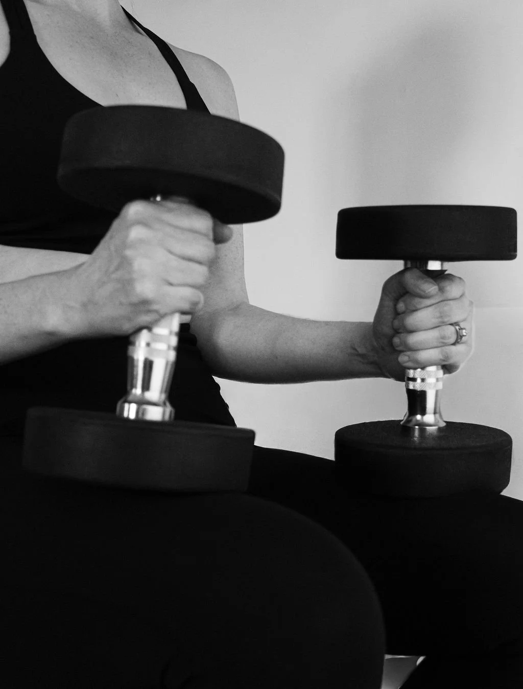 Woman holding Dumbbells