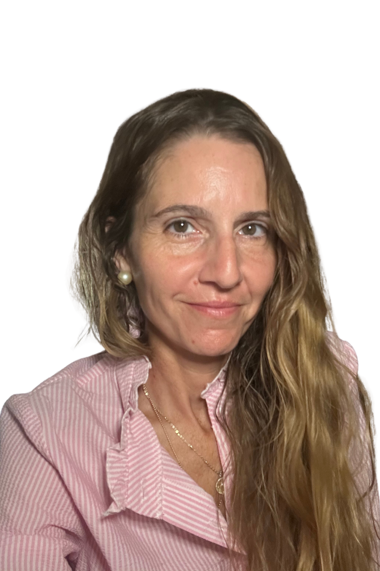 Portrait of a woman with long wavy hair, wearing a pink striped shirt and pearl earrings, smiling slightly, against a white background.