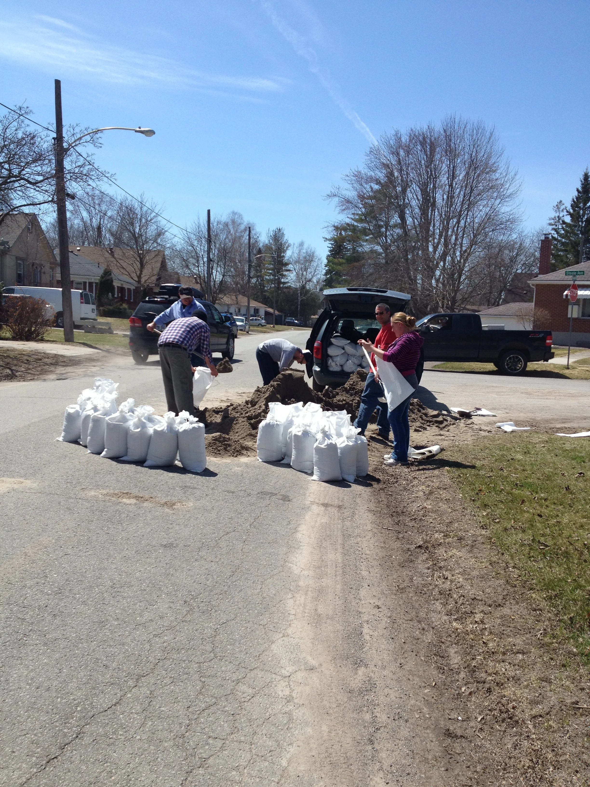 Helping Neighbours.  When the Otonabee River was flooding, Lesley Parnell arranged to have sand and sandbags delivered to the Otonabee Ward at Riverside and Graham Ave. Helped fill sandbags for her neighbours. Now a yearly practice when needed.
