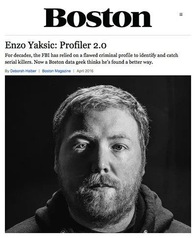 Black and white portrait of a man with a beard and short hair, wearing a dark hoodie, featured on the cover of Boston Magazine article titled 'Enzo Yakisic: Profiler 2.0'.