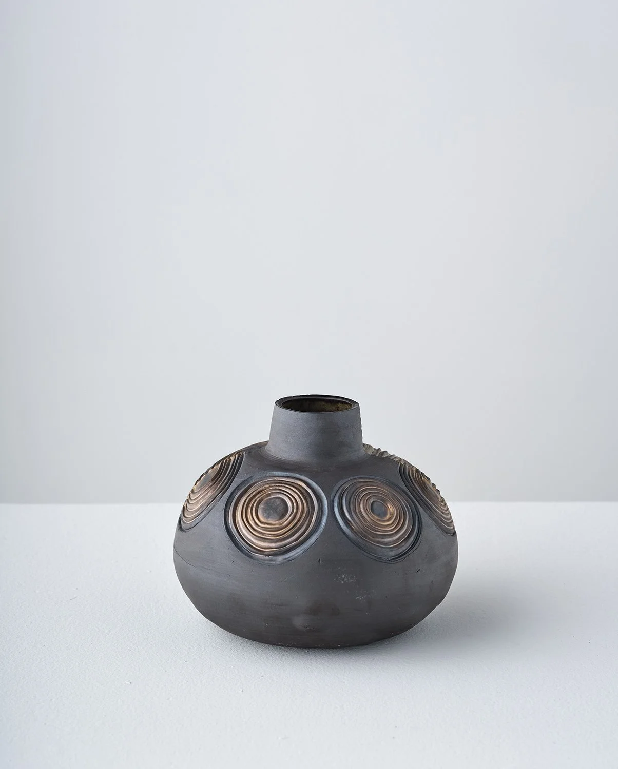 Half/Half V 2026 (back)  
6 x 7 x 7 in Black stoneware, glaze