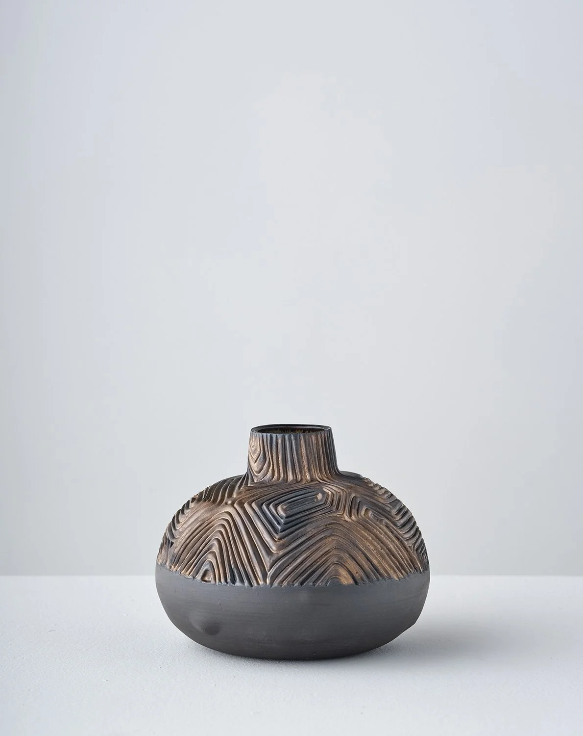 Half/Half V 2026 (front)  
6 x 7 x 7 in Black stoneware, glaze

