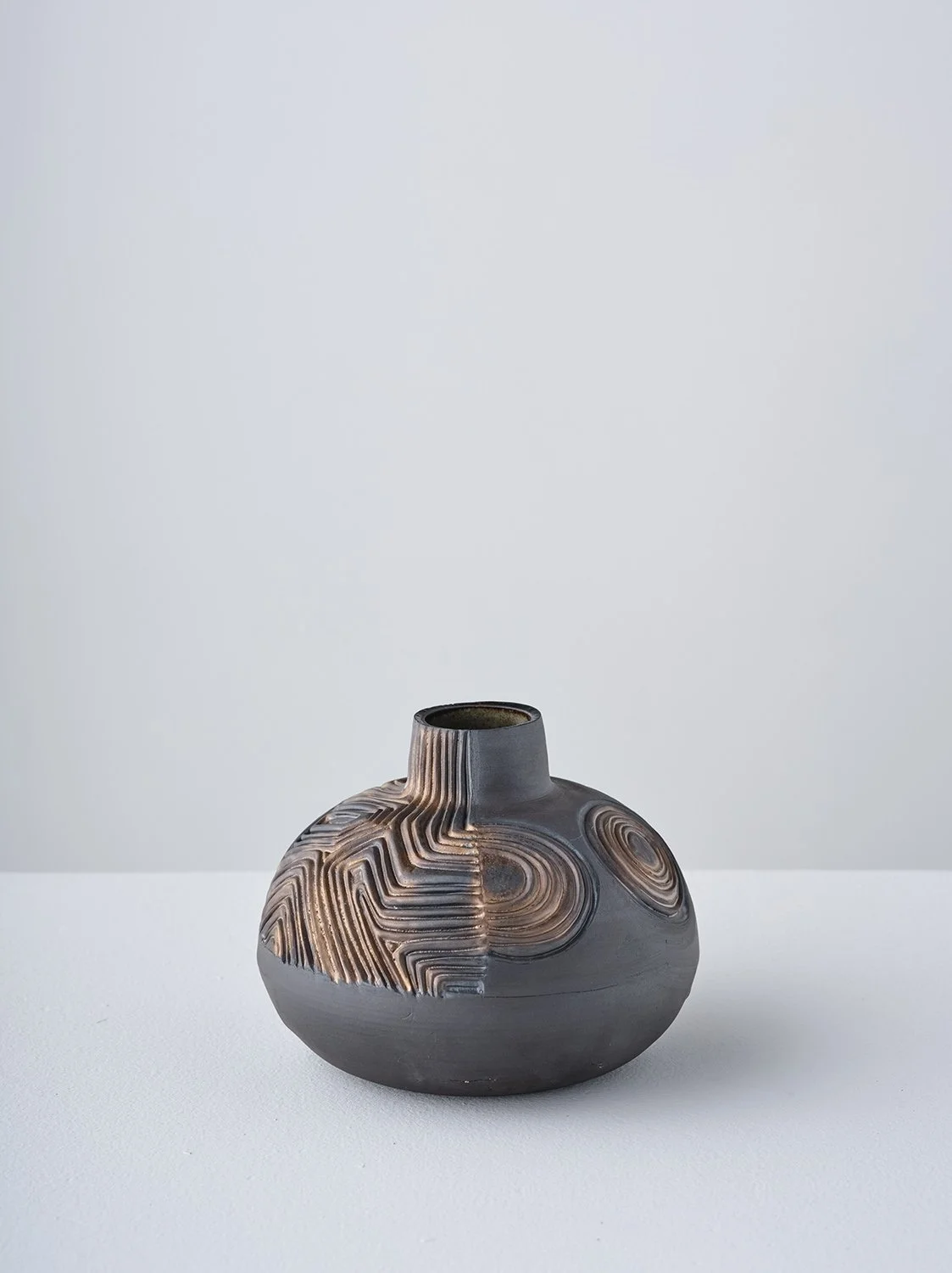 Half/Half V 2026 (side)  
6 x 7 x 7 in Black stoneware, glaze