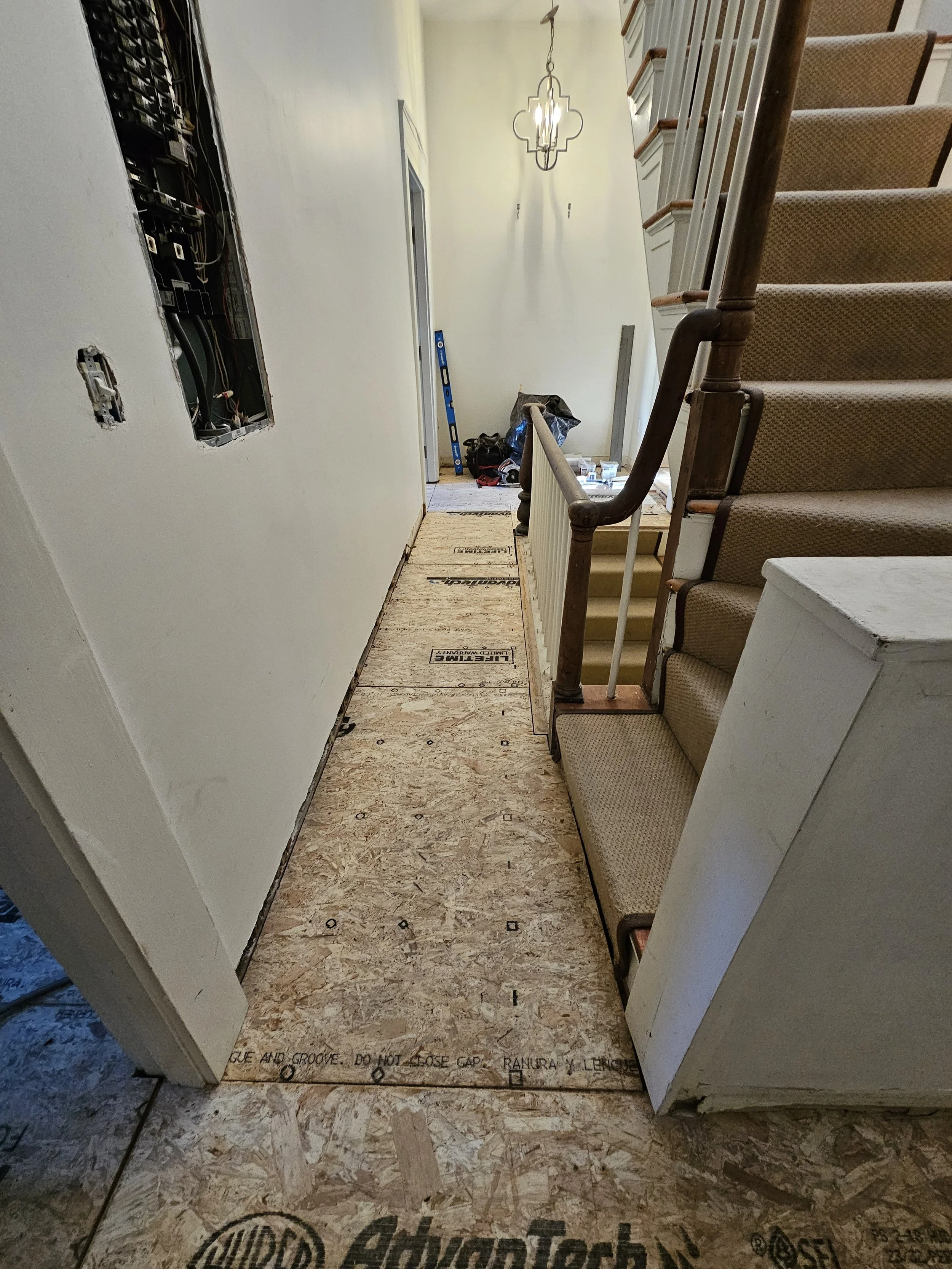 Out with the old, in with the new...subfloor! The subfloor under the prefinished red oak that was removed was not stable enough to meet code. We added a layer of Advantech subfloor to bring the floor up to code and take away the bounce. 