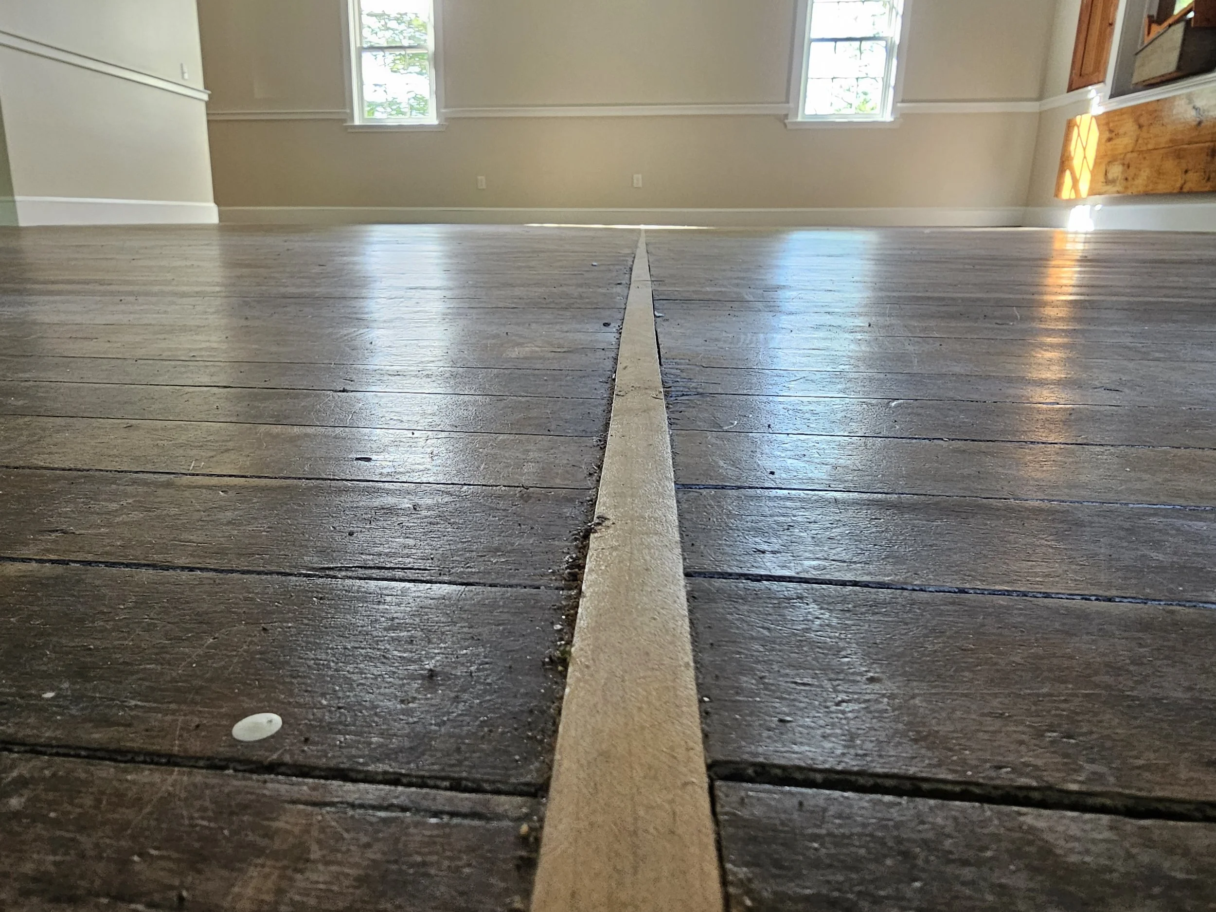 A close-up of the inlaid Maple strip, before refinishing.