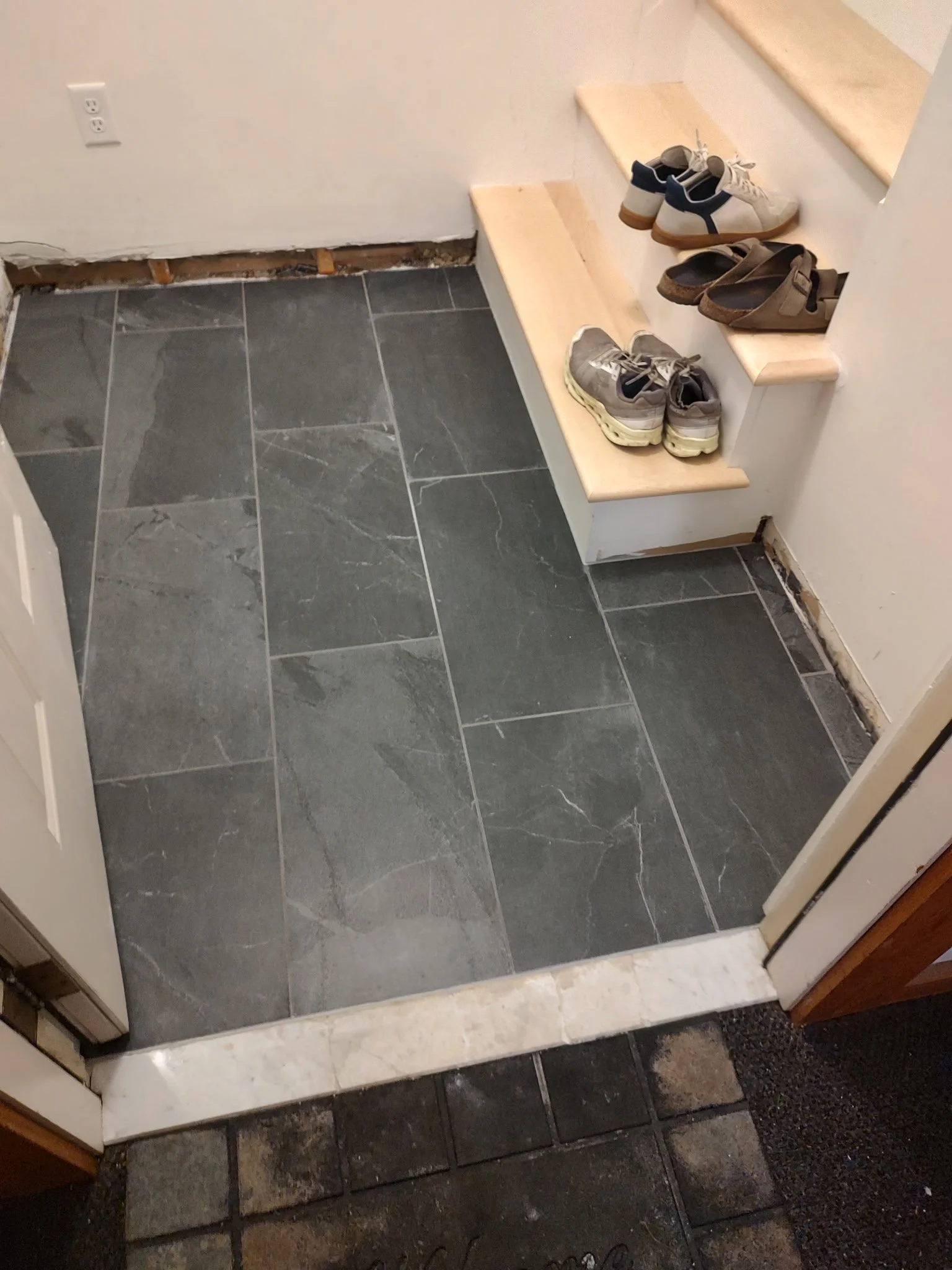 As an added bonus, we got to do the tile installation in the entry way and upgrade the floor from the first floor all the way to the third. 
