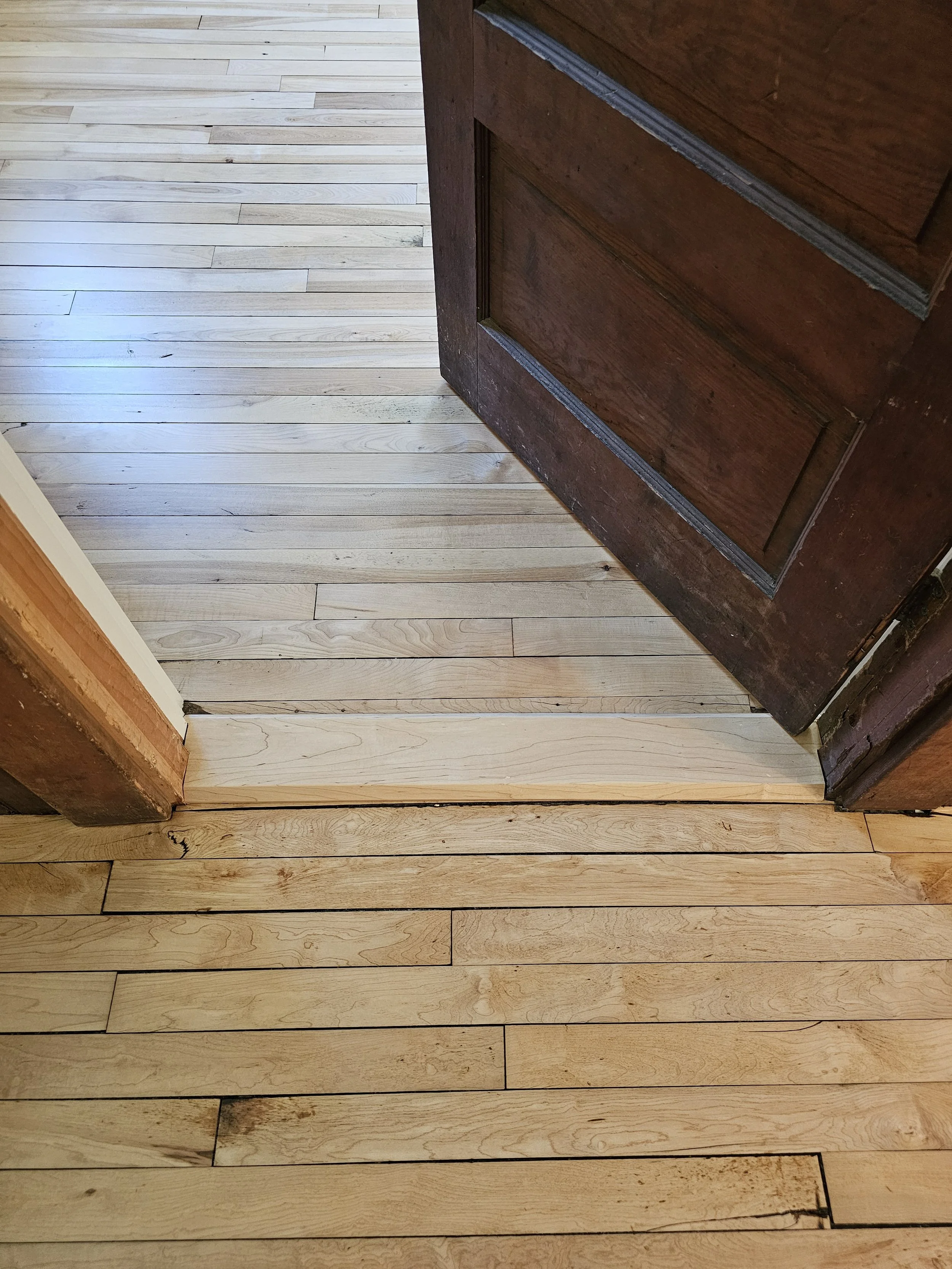 The door transition unfortunately didn't make it through the restoration as it had significant deterioration, so Fat Andy's was kind enough to donate a new piece of maple to replace it. A little new in with the old and one more piece added to the his
