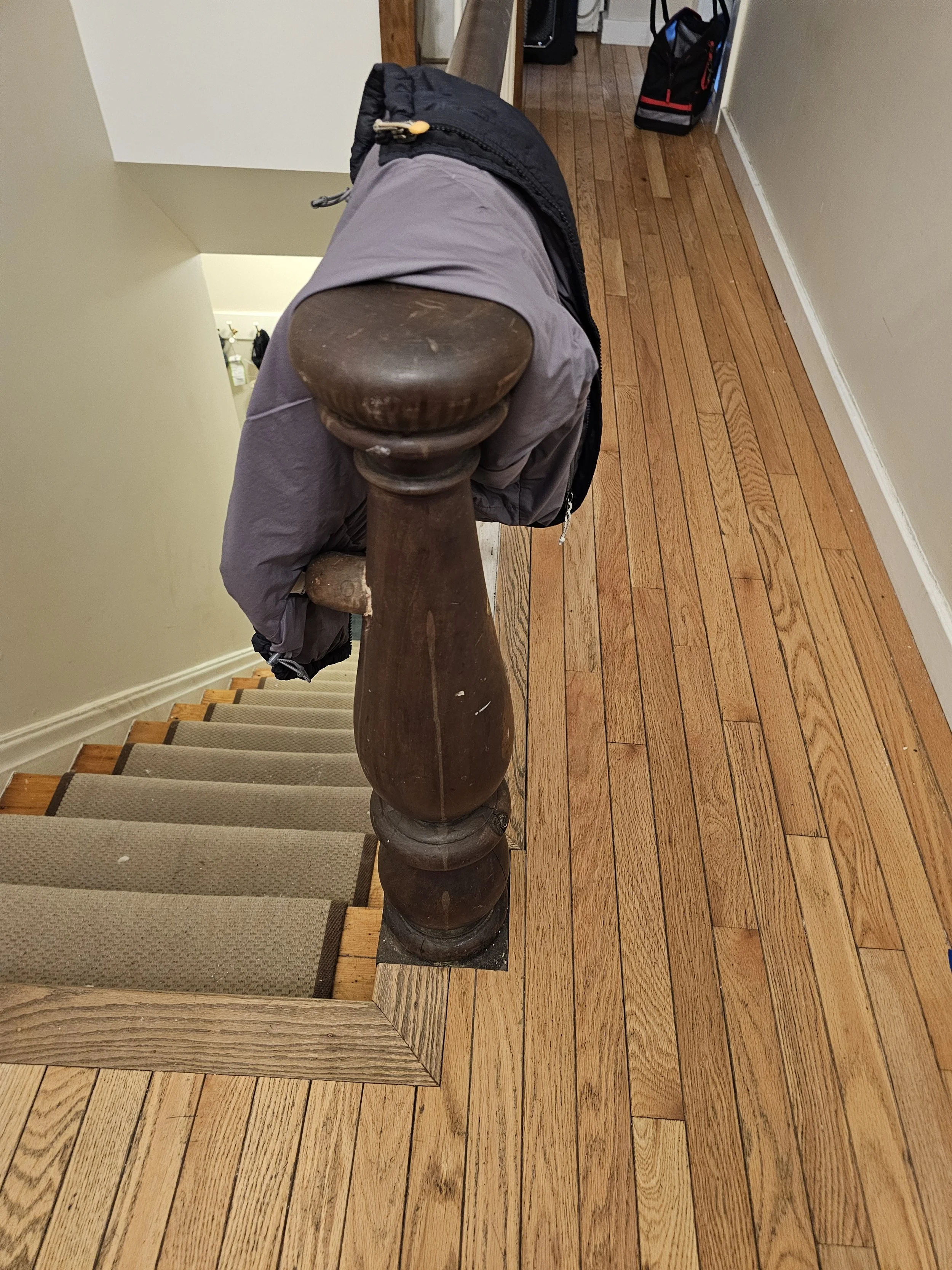 Before renovation - the red oak flooring was poorly installed originally and water damaged. 