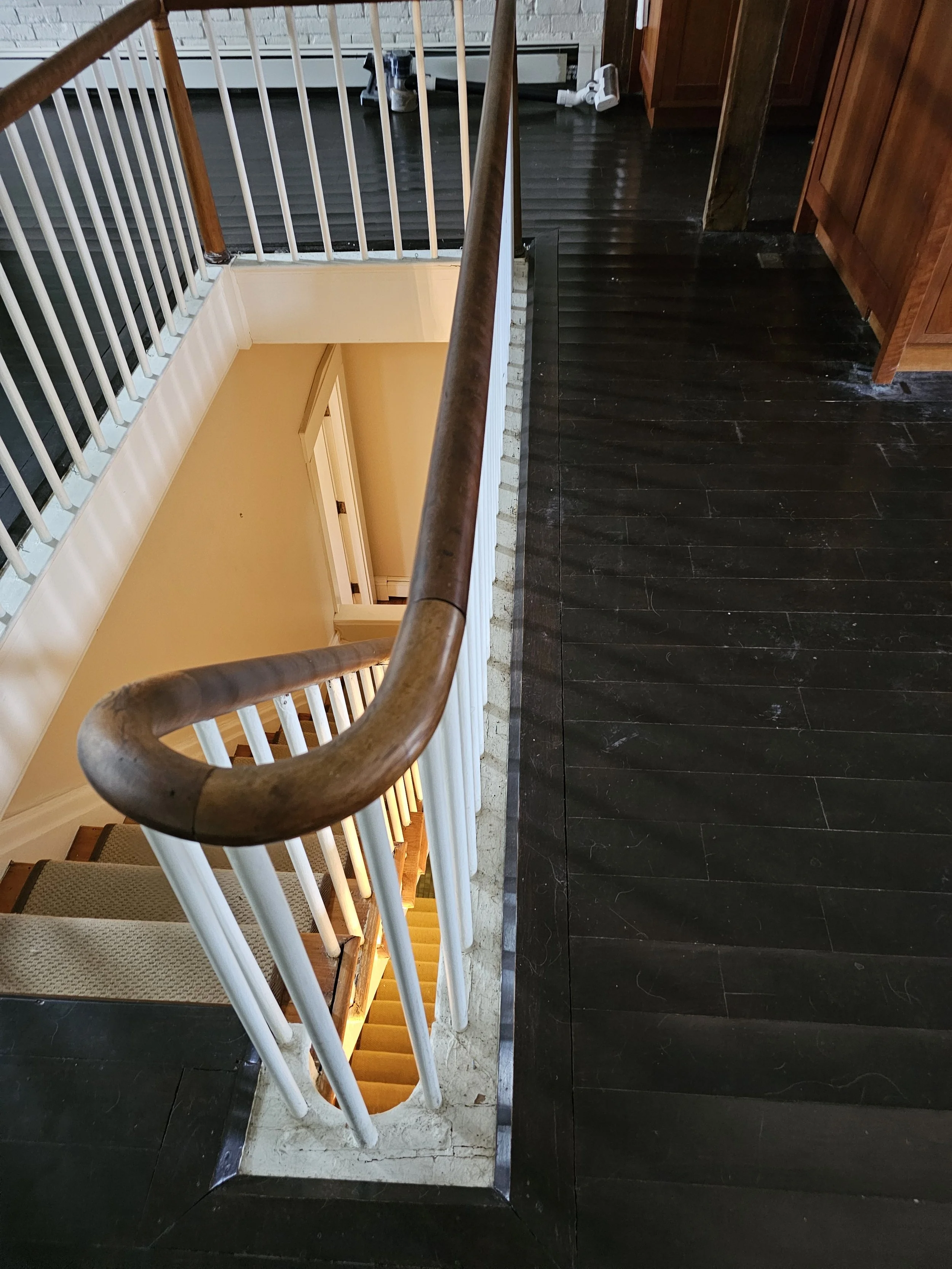 Before renovation, after water damage. The floor boards were cupping and the staircase was as creaky as they come!