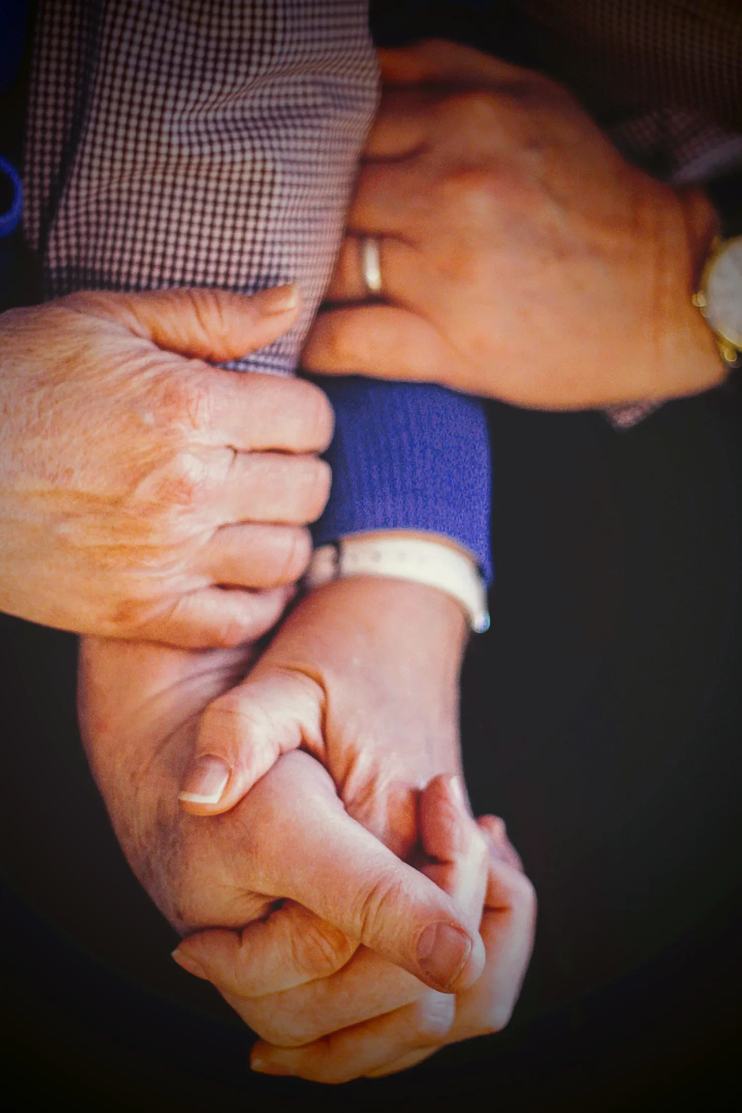 Hands holding hands to provide comfort at St. Thomas’ Church Whitemarsh.