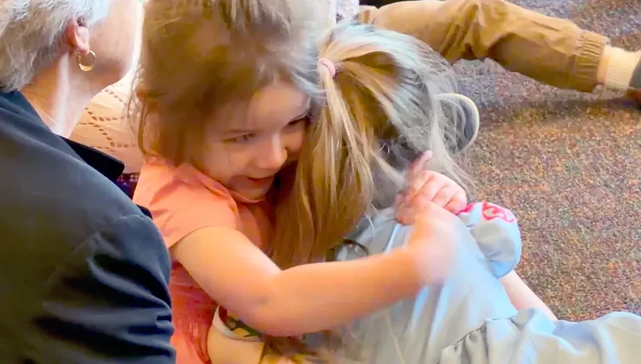 Two young children hugging at St. Thomas’ Church Whitemarsh.