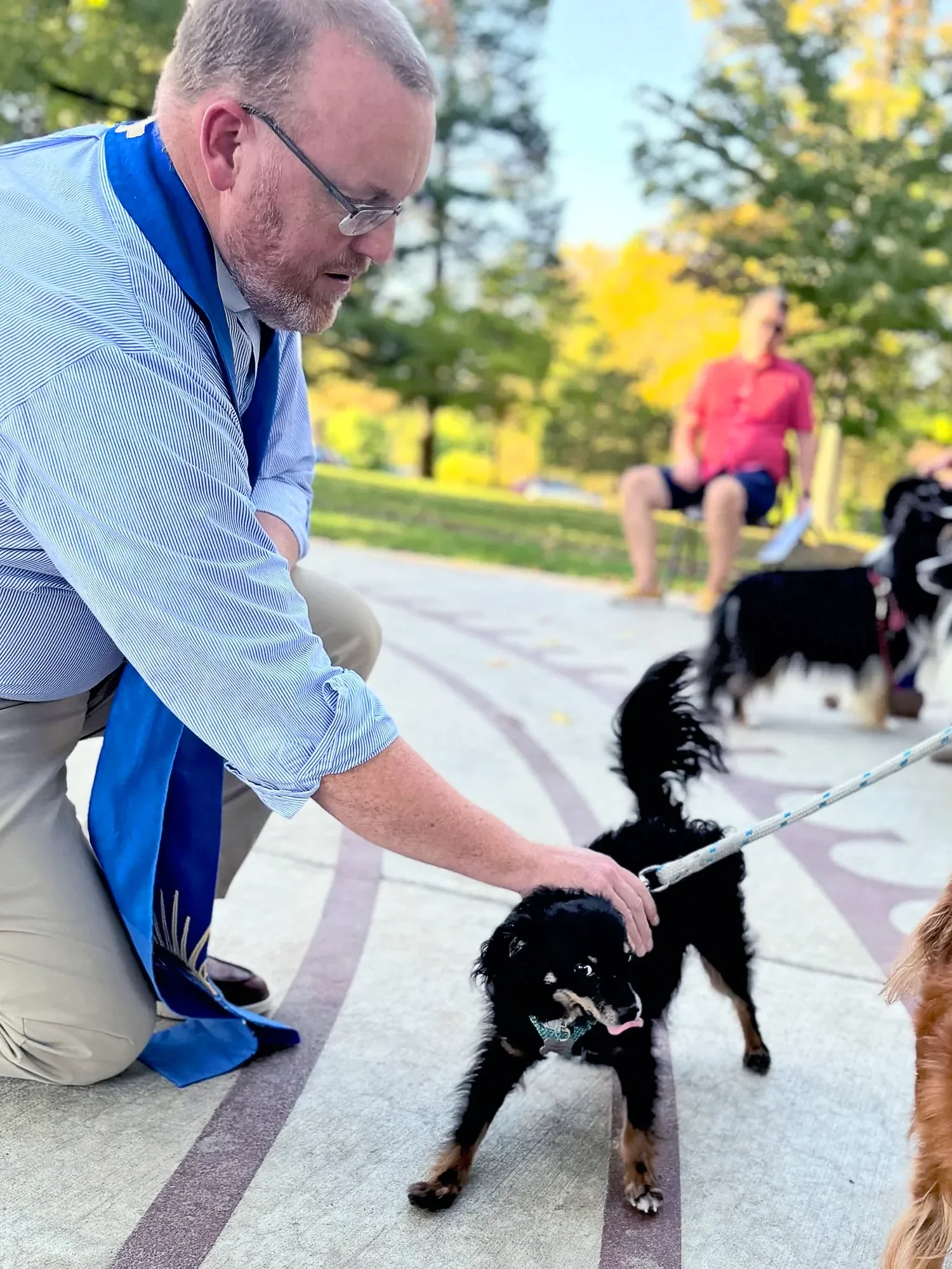 Father Dave and a small dog with the Animal Ministry at St. Thomas’ Church Whitemarsh.