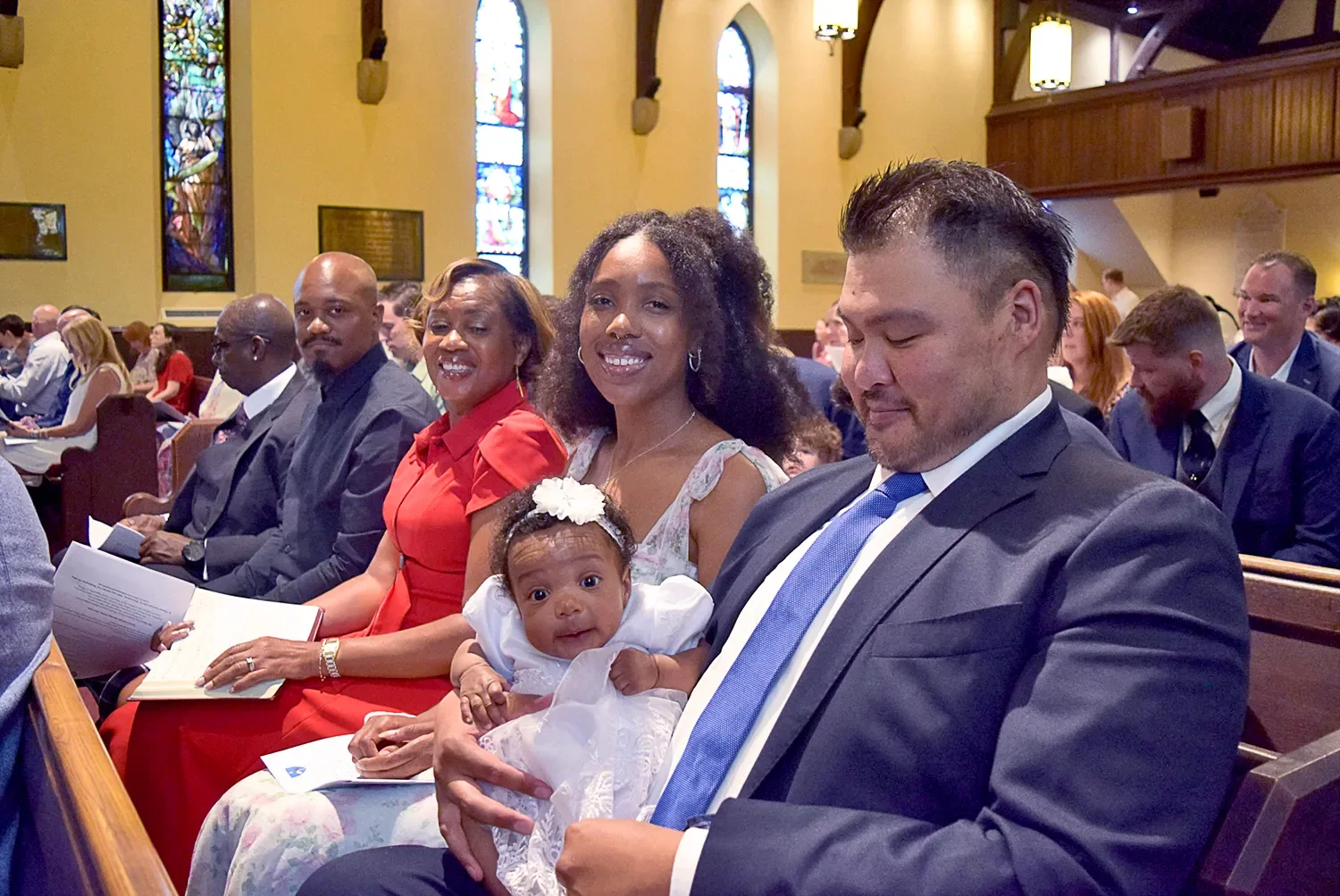 Family portrait seated during baptism service at St. Thomas’ Church Whitemarsh.