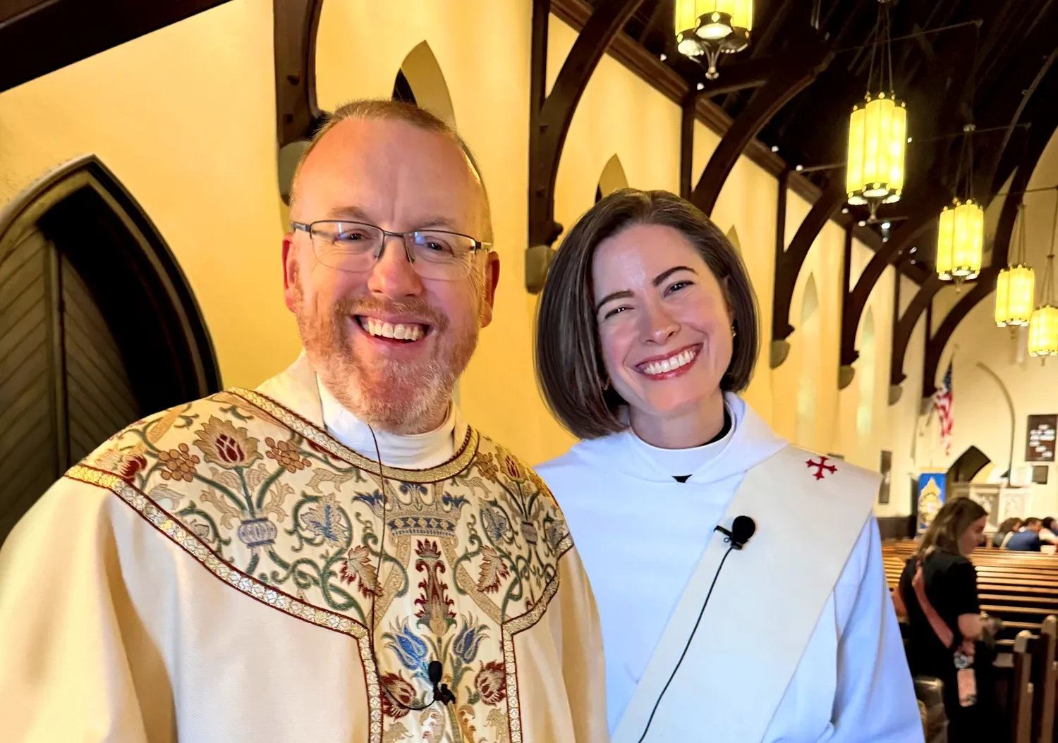 Father Dave and Mother Amy standing together and smiling after a service at St. Thomas’ Church Whitemarsh.