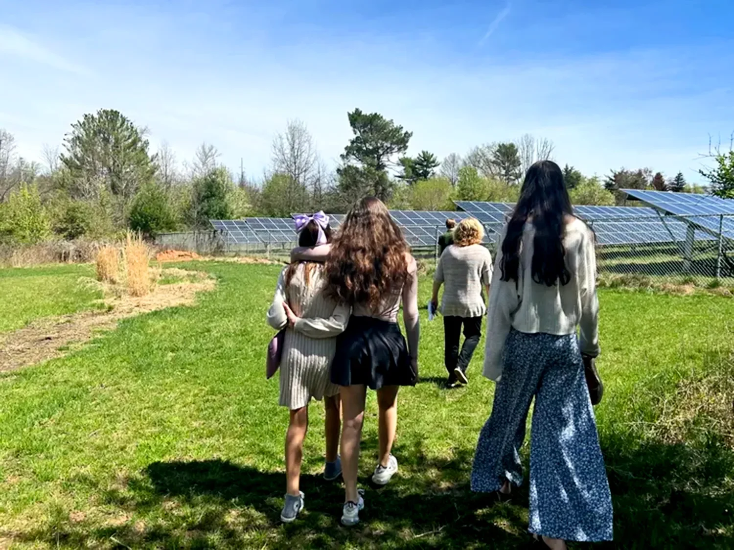 Teens walking on walking trail by solar farm at The Retreat at St. Thomas’ Church Whitemarsh.