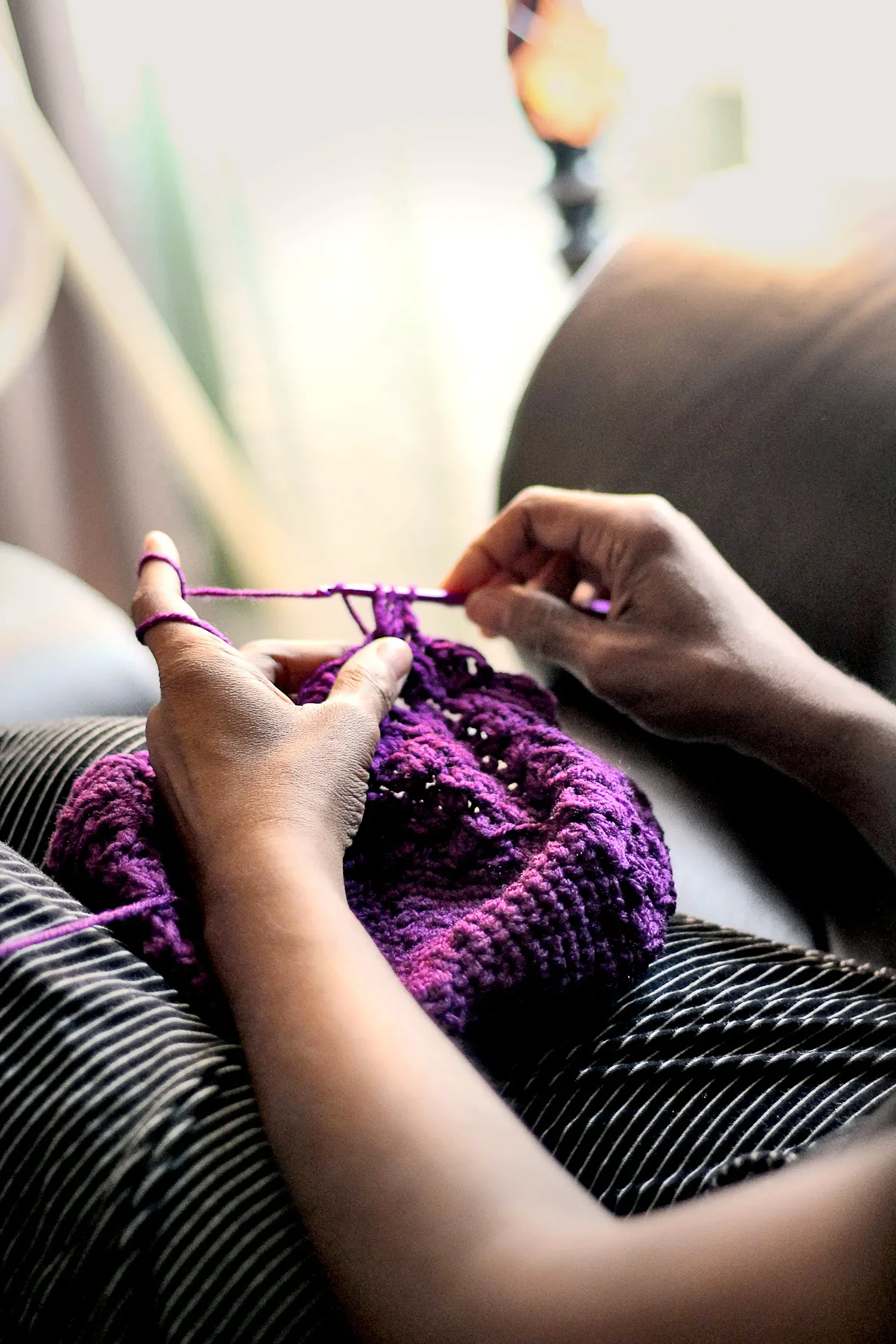 Hands knitting a prayer blanket as part of the Knitting Ministry for St. Thomas’ Church Whitemarsh.