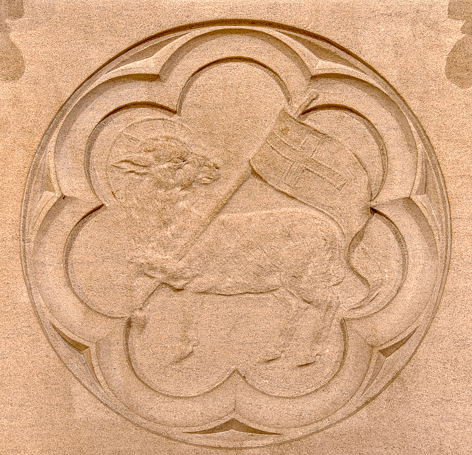 Detail of a carved lamb holding a flag with a cross at St. Thomas’ Church Whitemarsh.