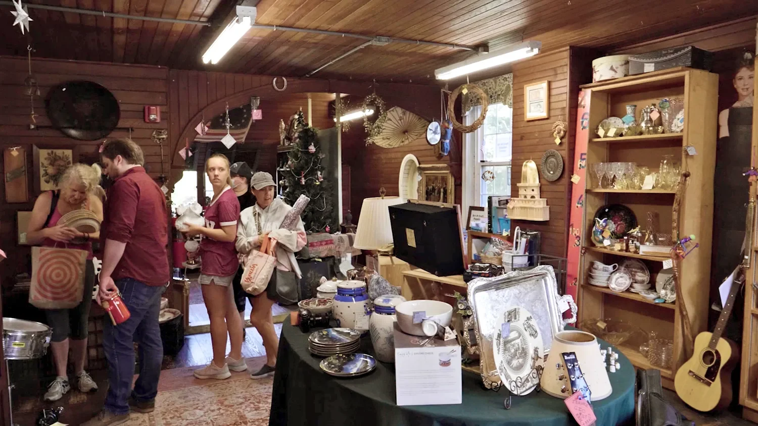 People browsing glassware and china inside at The Barn St. Thomas’ Church Whitemarsh.