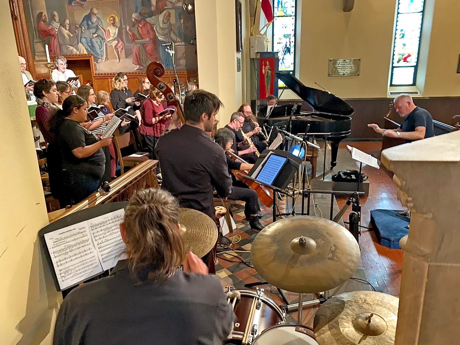 Michael Smith, Minister of Music, directing Missa Gaia concert in the main church at St. Thomas’ Church Whitemarsh.