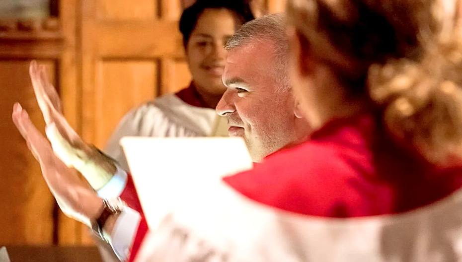 Michael Smith, Minister of Music, conducting the choir during a church service at St. Thomas’ Church Whitemarsh.