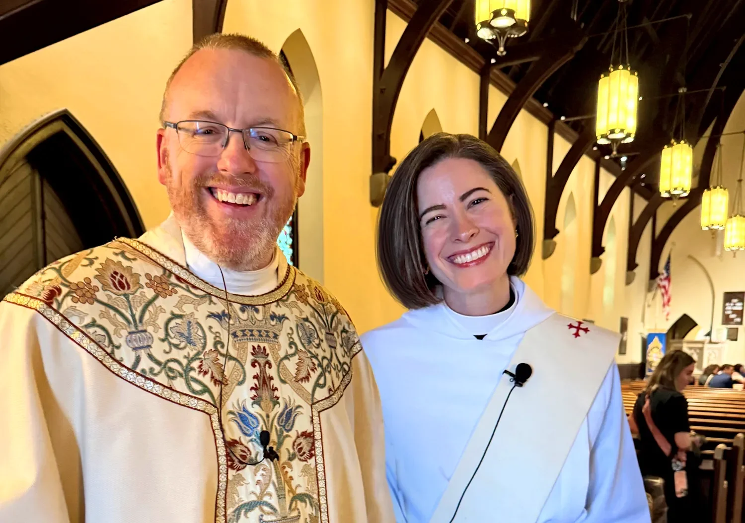 Father Dave and Mother Amy standing together and smiling after a service at St. Thomas’ Church Whitemarsh.