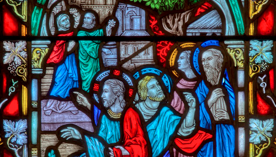 Stained glass window depicting robed figures in a biblical scene at St. Thomas’ Church Whitemarsh.