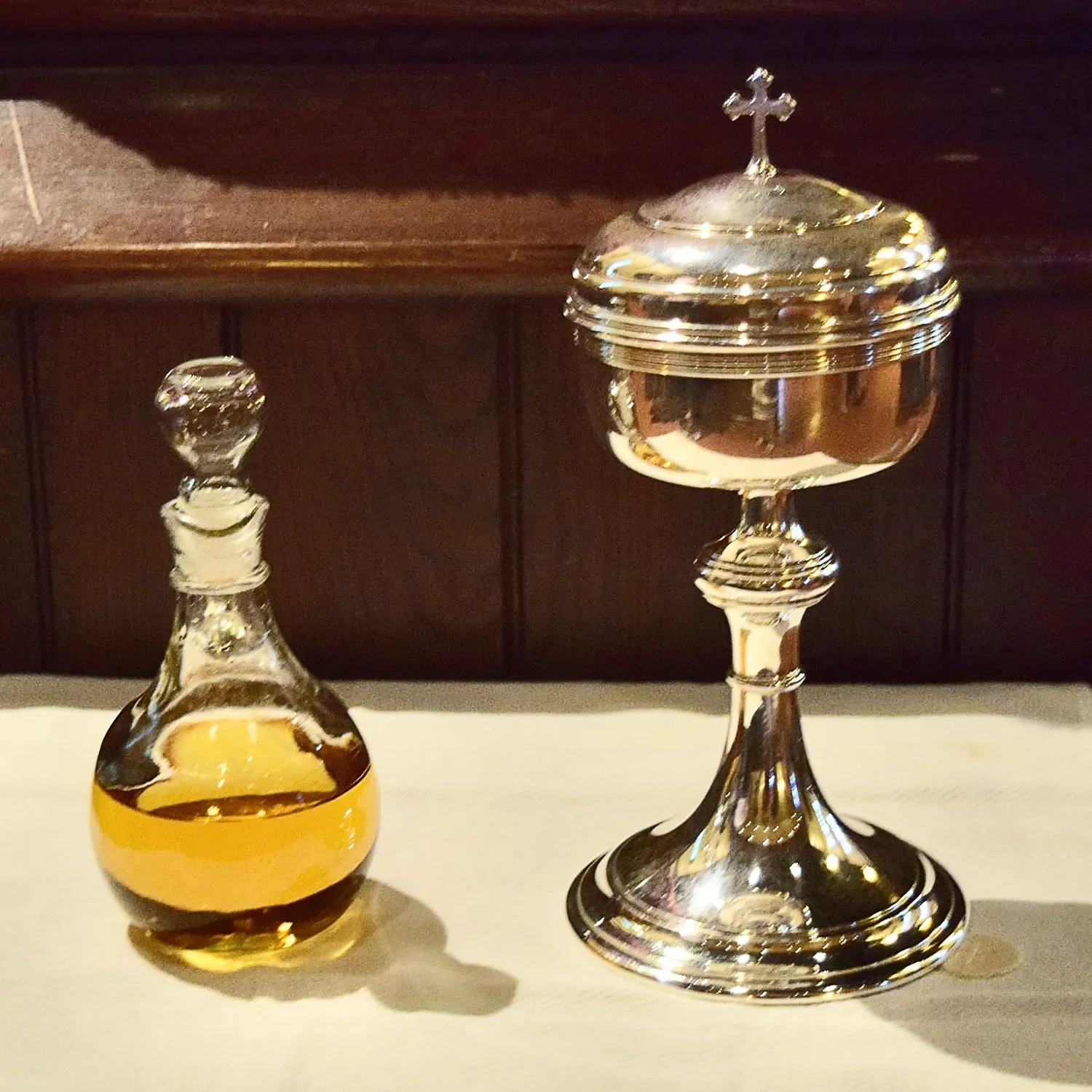 Glass cruet and silver chalice for baptism service at St. Thomas’ Church Whitemarsh.