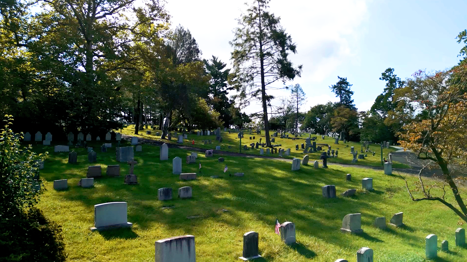Peaceful sunrise over a beautiful green hill in the historic cemetery at St. Thomas’ Church Whitemarsh.