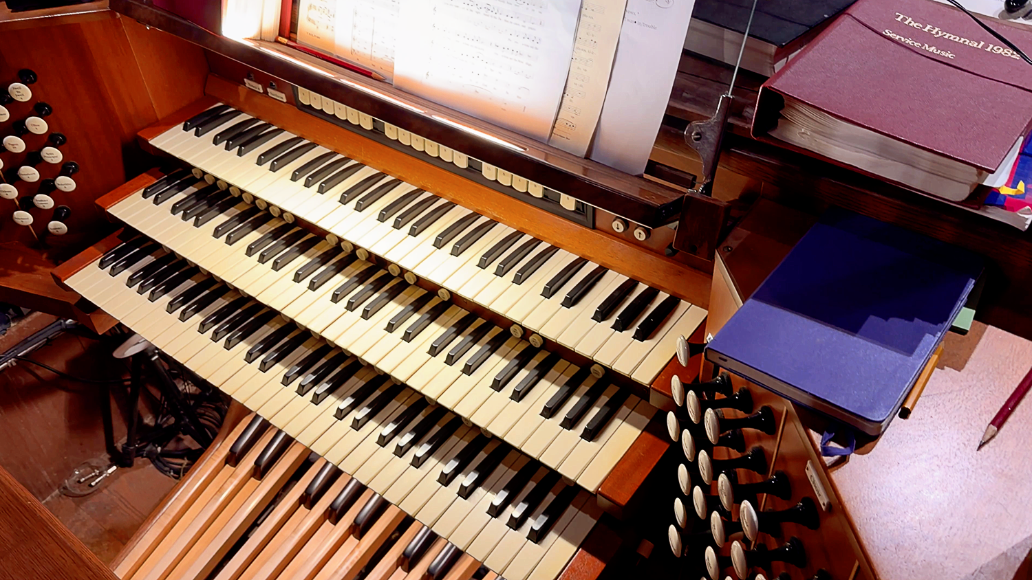 Church pipe organ console with sheet music at St. Thomas’ Church Whitemarsh.