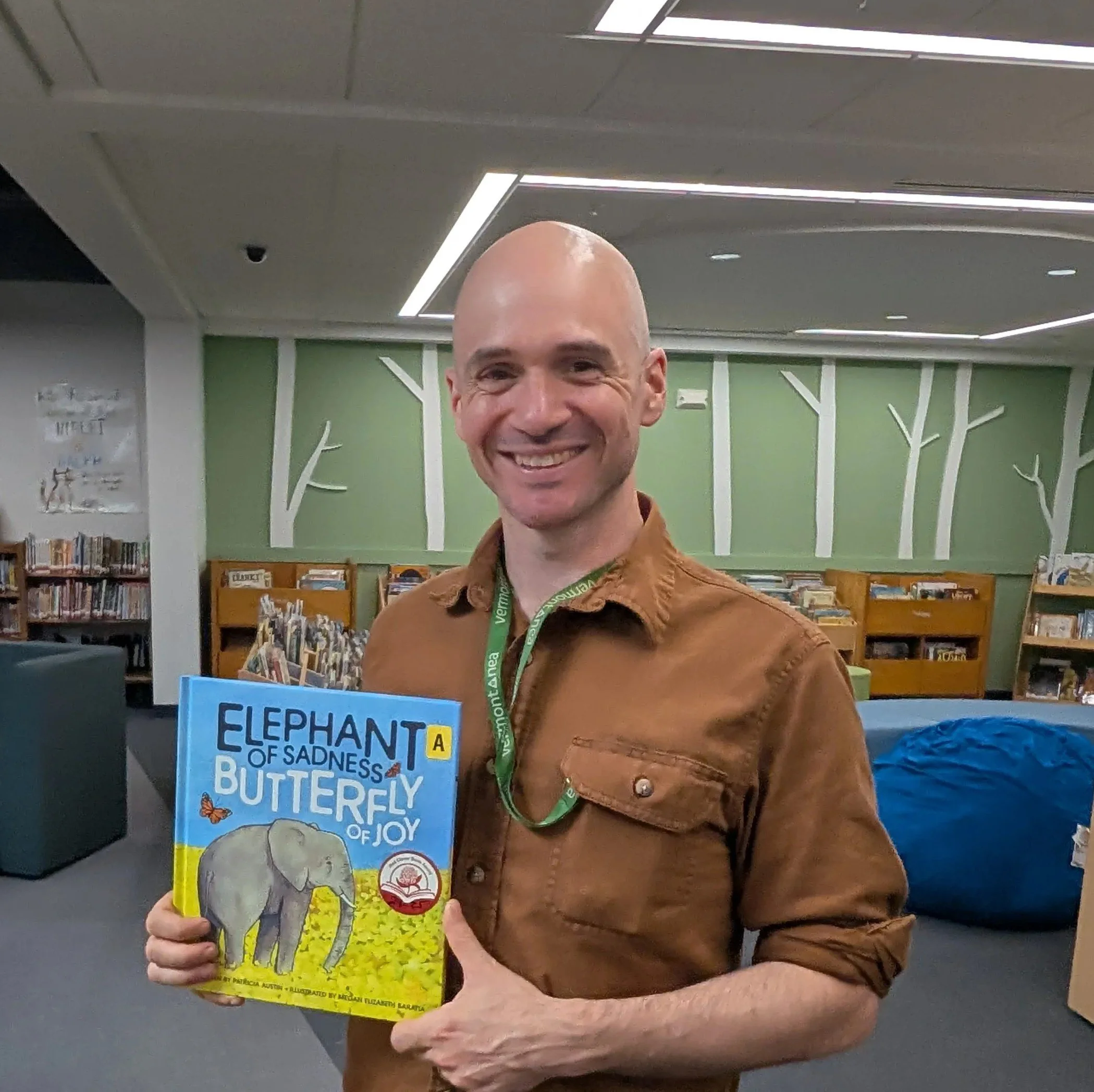 Photo of Matt Gile holding a children's book