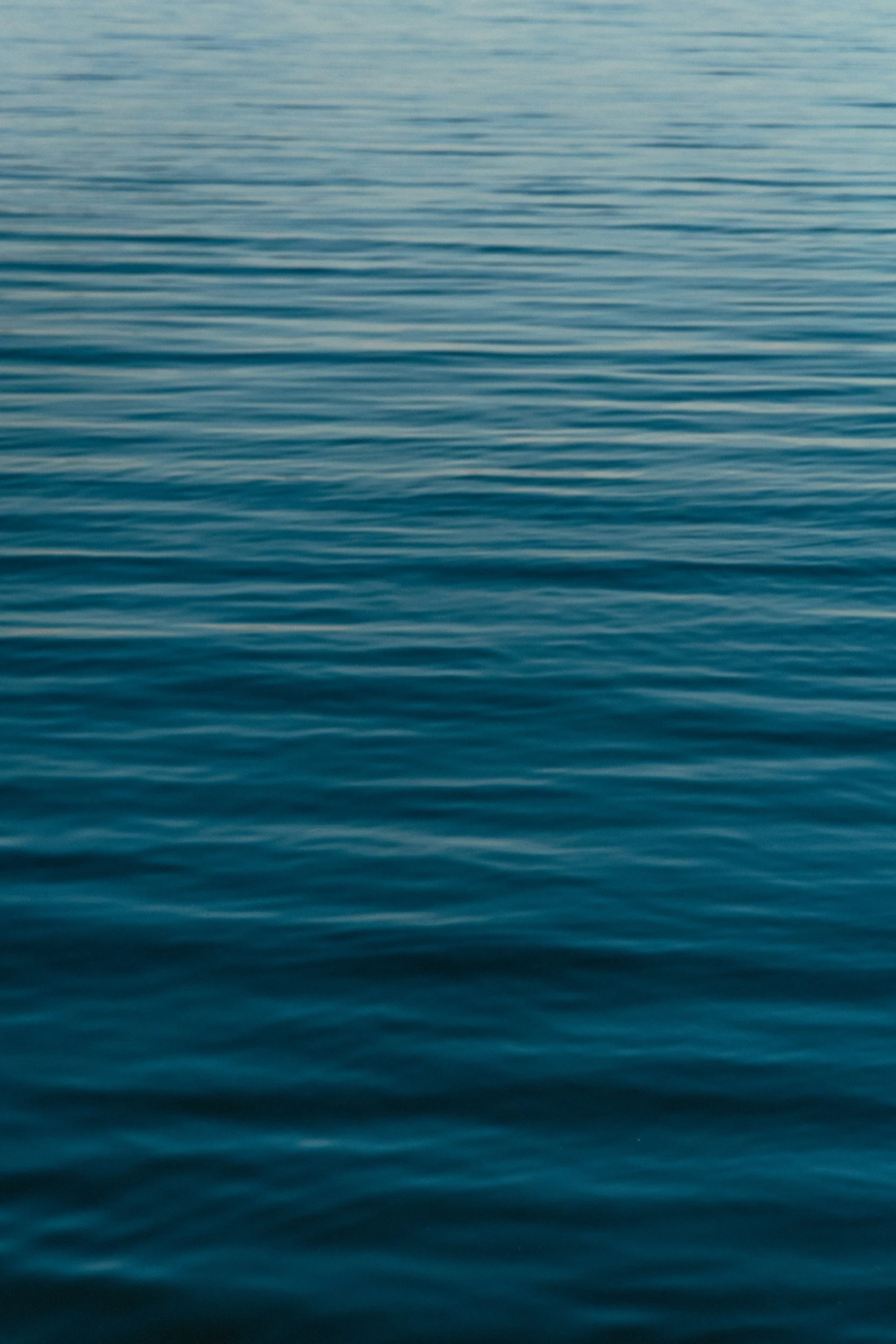 Calm ocean water with gentle ripples and no objects.