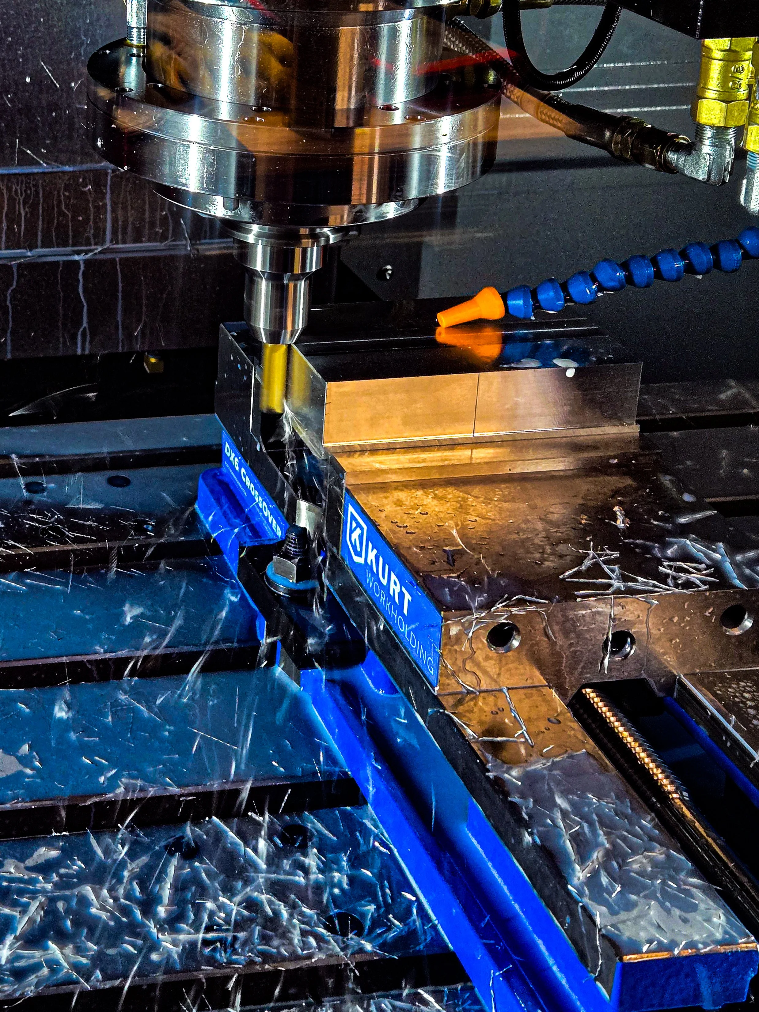 Live tool CNC machining center milling and drilling a precision metal component in a single setup.