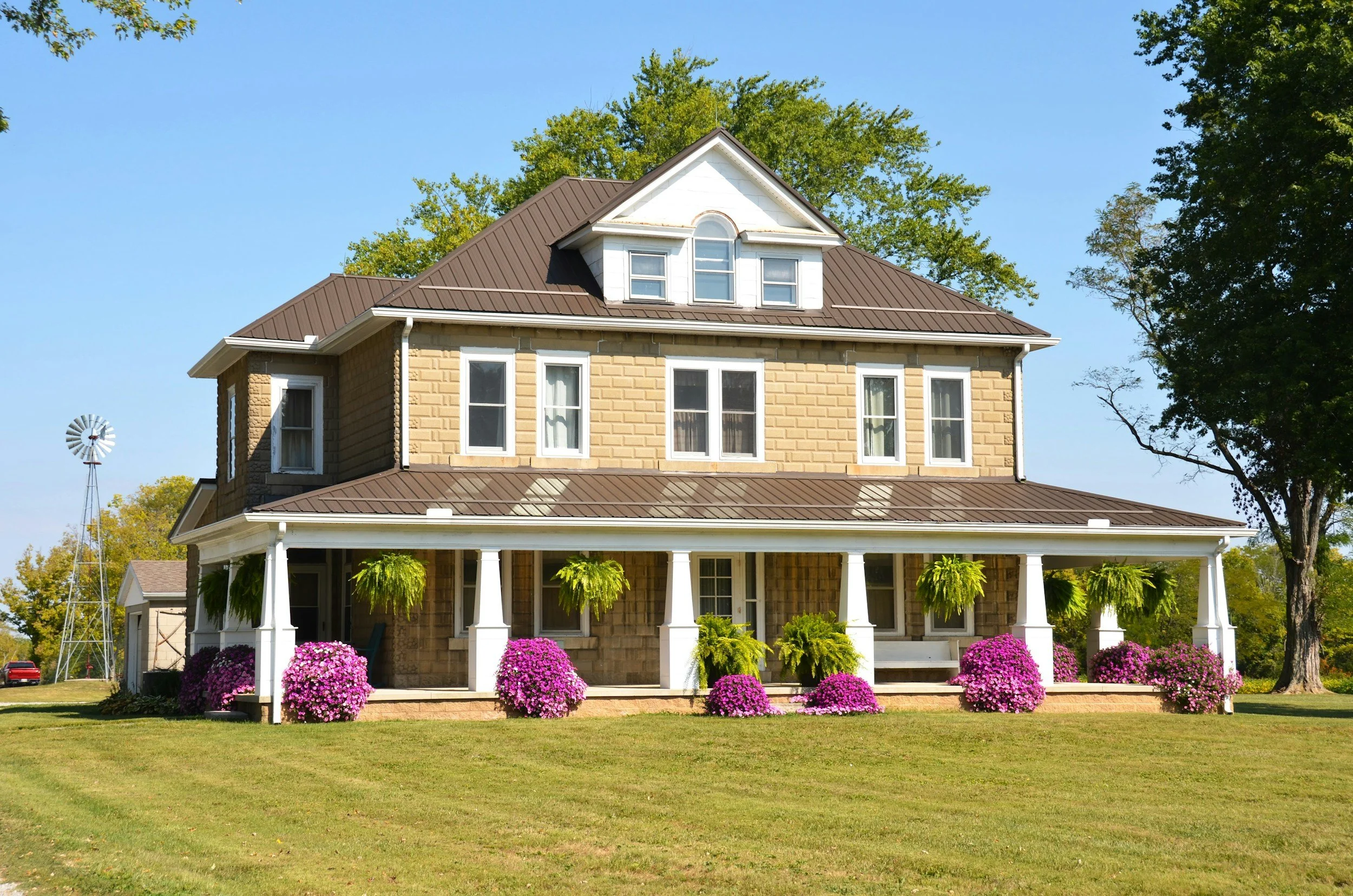 Blueprint Elite Realty — Georgia's luxury boutique real estate brokerage — Exterior view of luxury craftsman home beautiful landscaping.