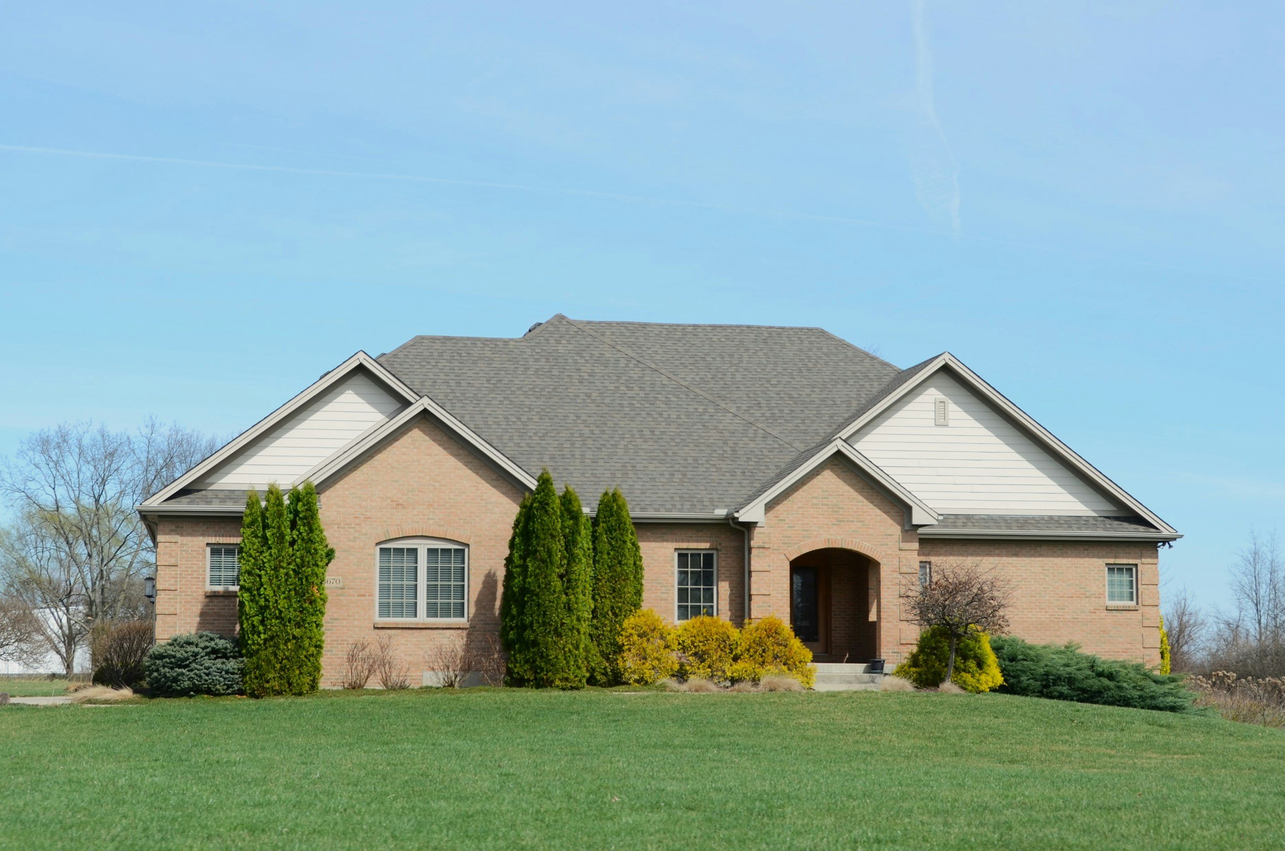 Blueprint Elite Realty — Georgia's luxury boutique real estate brokerage — Exterior view of luxury ranch style home with beautiful landscaping