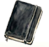Old, well used black journal with a leather cover