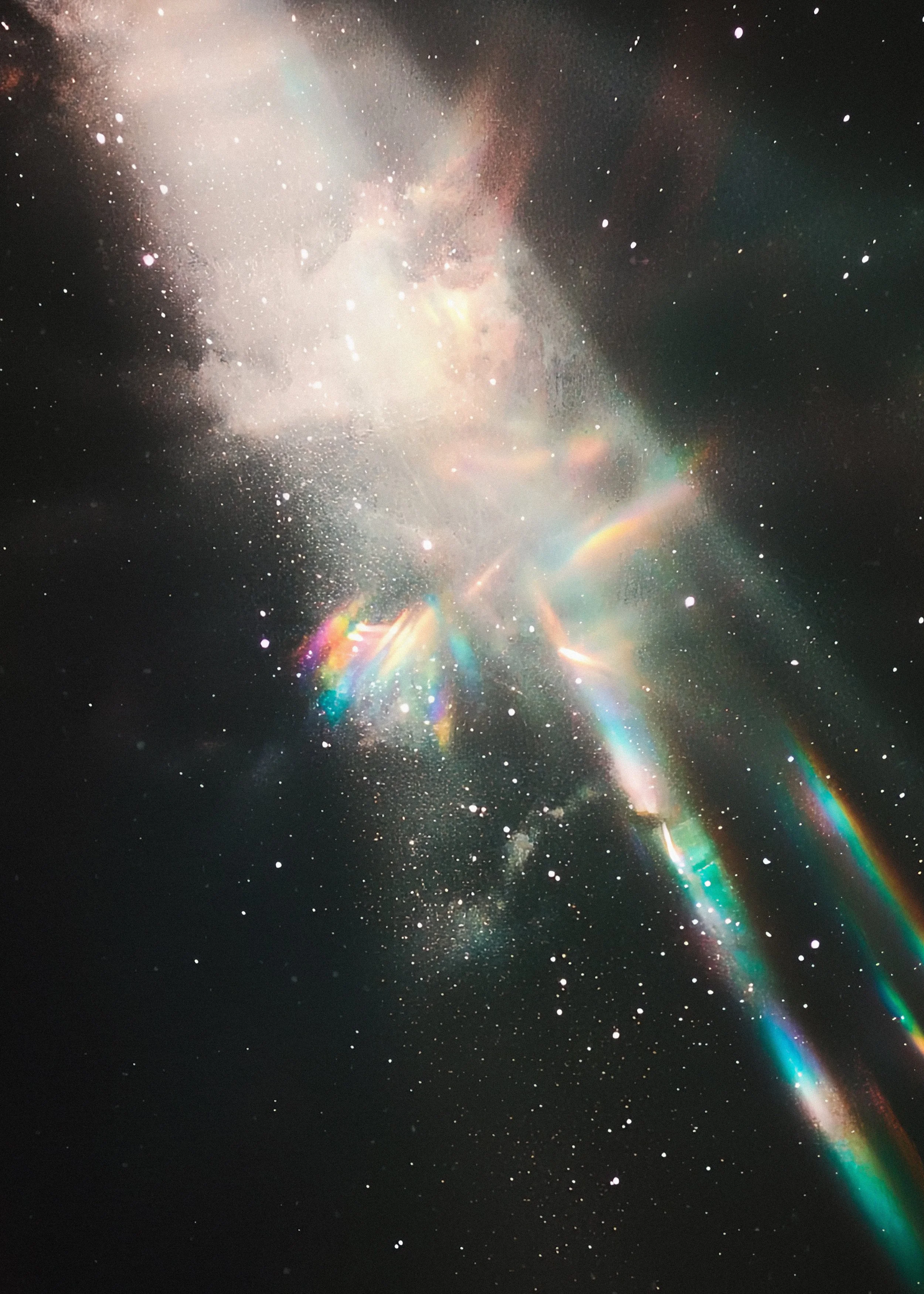A colorful depiction of a nebula or galaxy in space with stars and cosmic dust.