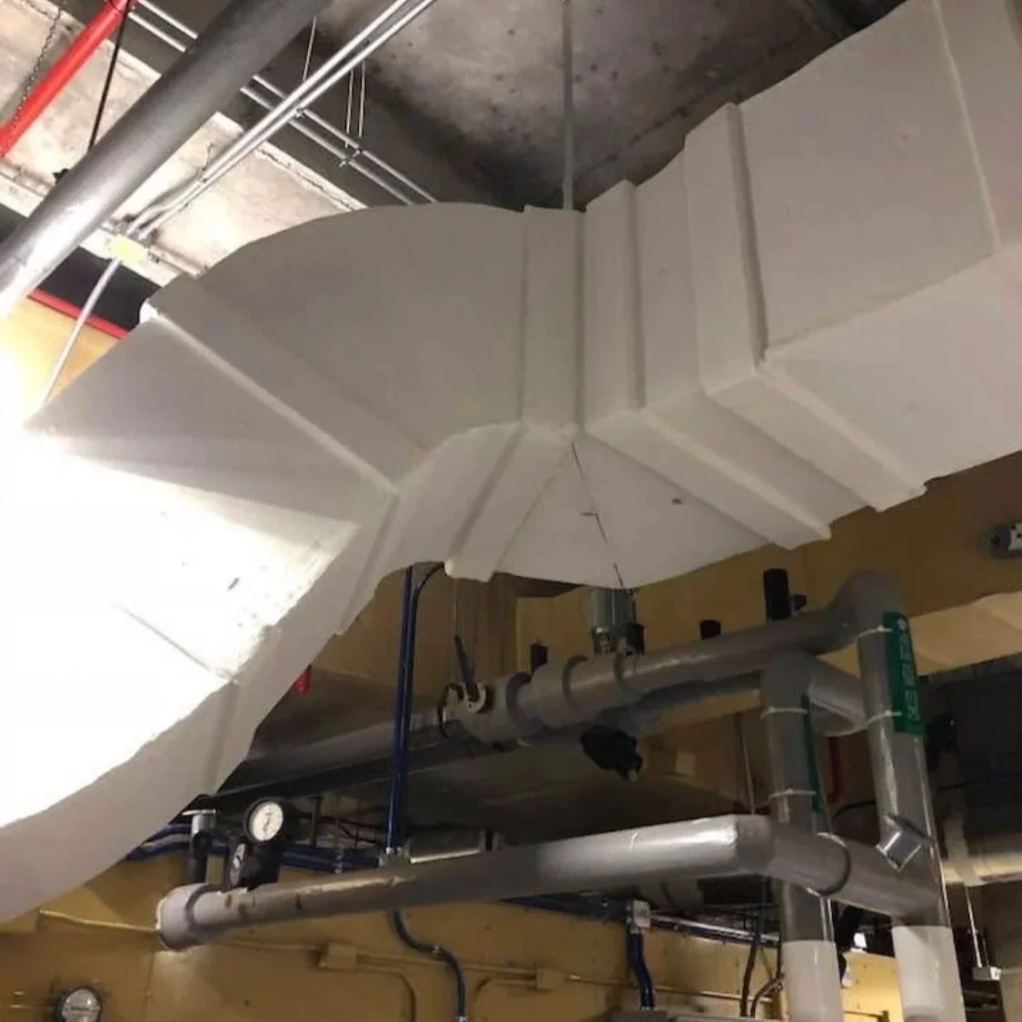 Commercial HVAC duct insulation and mechanical piping system installed in Houston commercial facility.