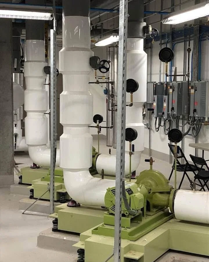 Mechanical room insulation project featuring chilled water piping, PVC jacketing, and commercial mechanical systems. Installed by Vali Shield, LLC for condensation control energy efficiency, and equipment protection.