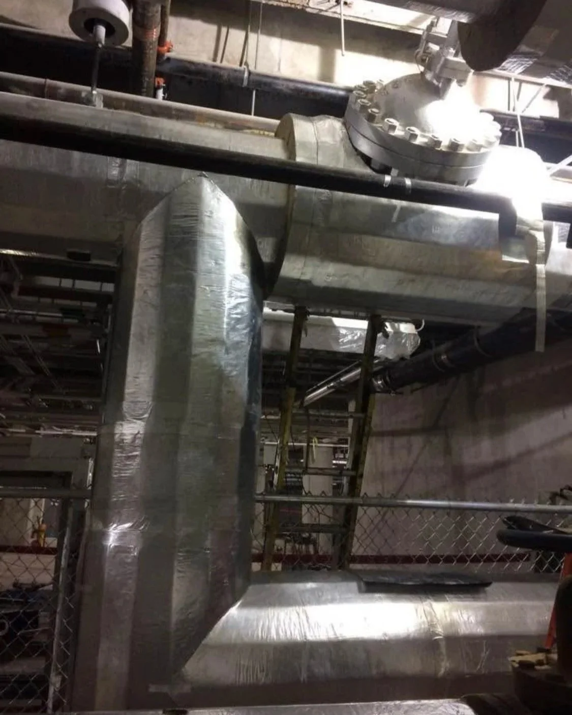 Commercial steam pipe insulated with mineral wool insulation and protective jacketing. installed by Vali Shield, LLC to provide thermal protection, fire resistance, and long-term performance for commercial and industrial facilities.