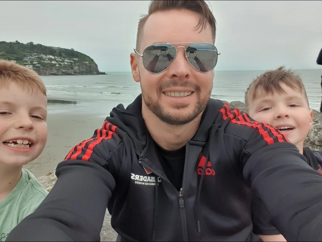 Nick Sail with his two sons enjoying time together at the beach