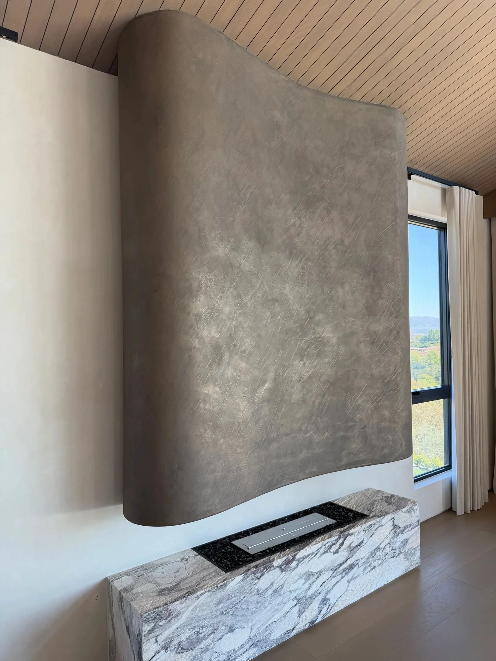 metal-plaster-sculptural-fireplace-california-wall-design.jpeg