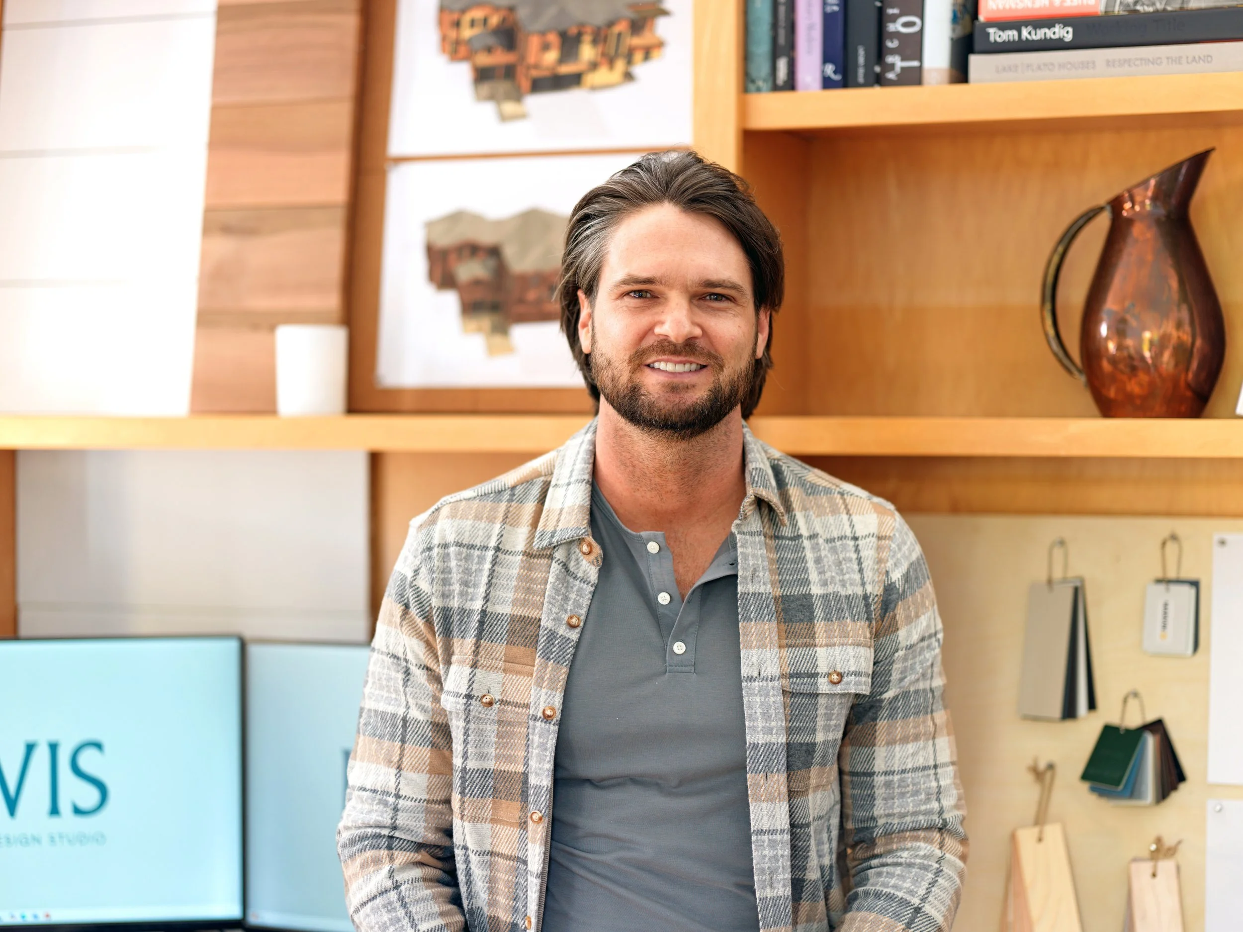 owner devin lewis in the permit drawing production studio