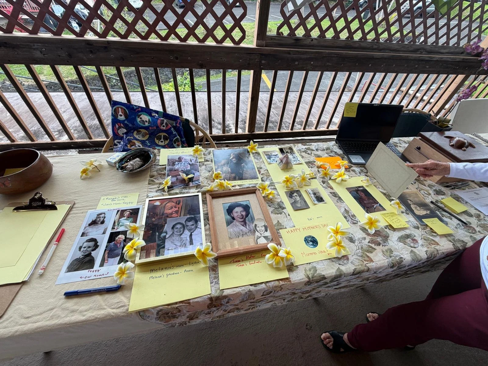 Mother's Day celebration, set near a wooden porch with a lattice railing at New Thought Center of Hawaiʻi
